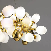 Post Modern Linear Grape Branch Chandelier Over Dining Table